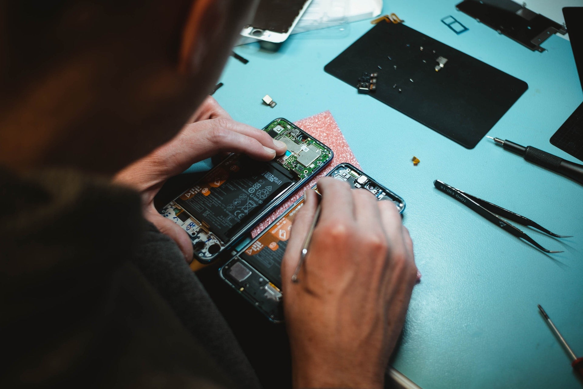 Technician Performing A Phone Repair