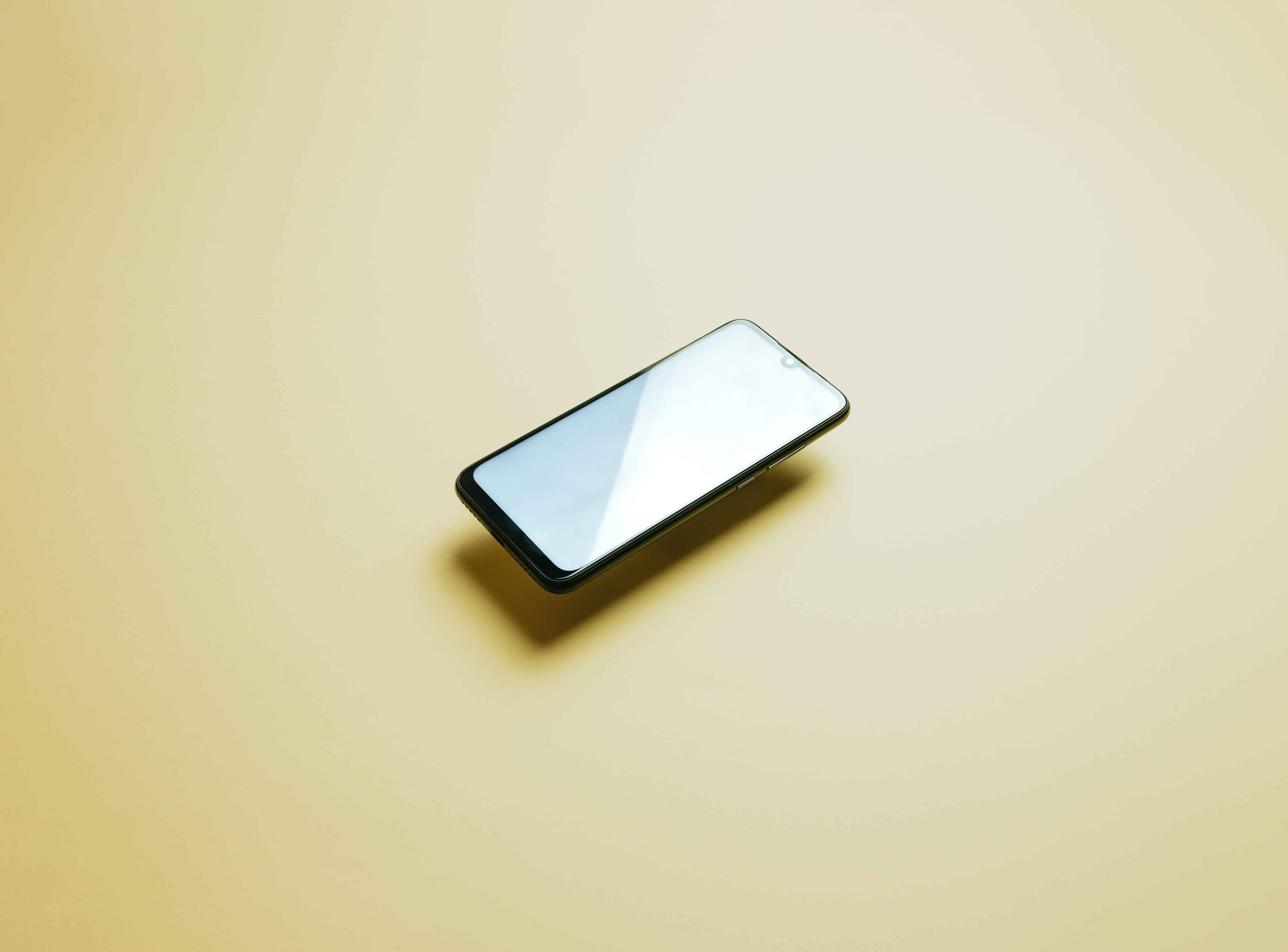yellow-background-with-a-mobile-floating.jpg